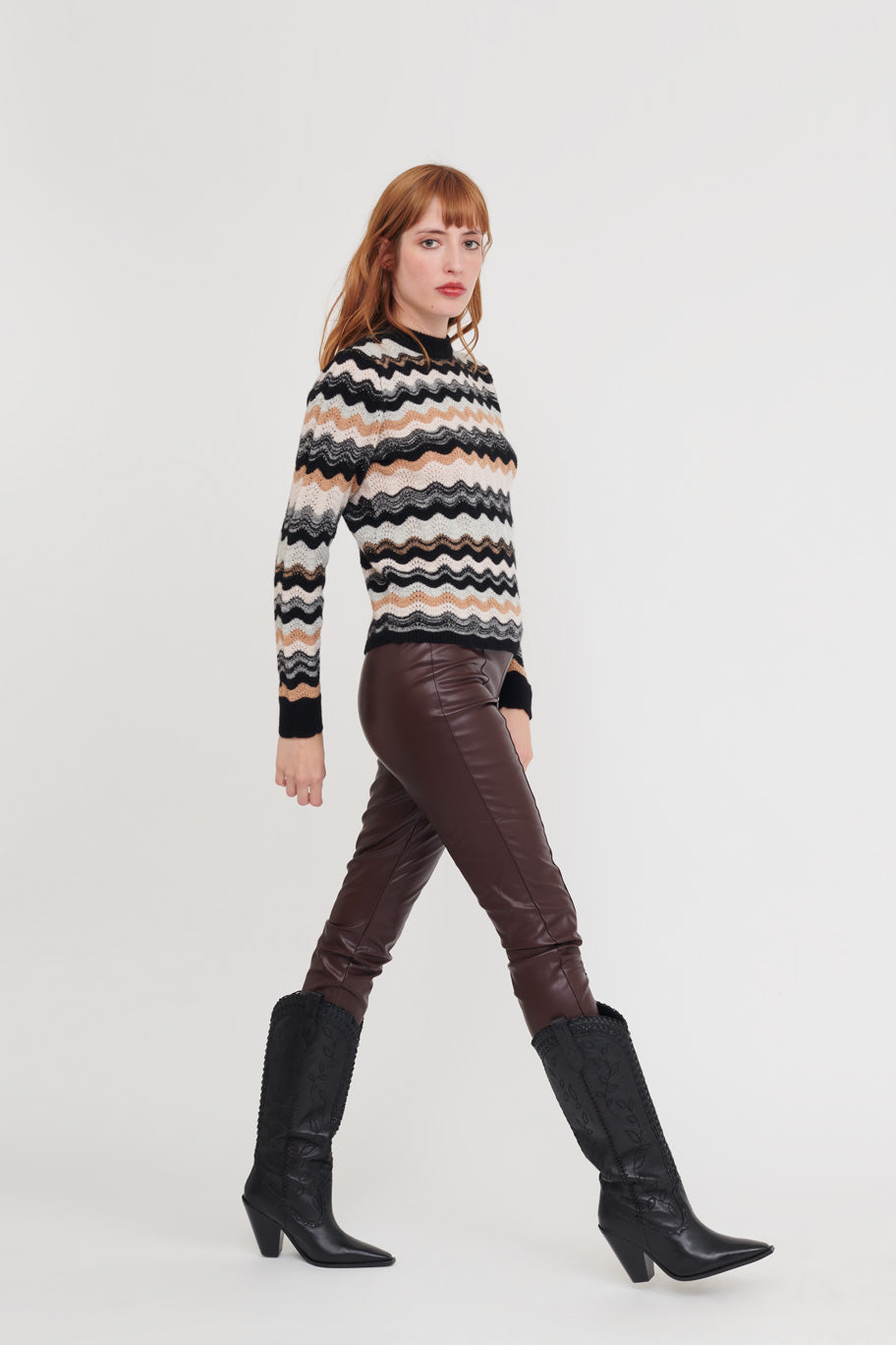 Read headed model wears a black and natural stripe crew neck with a pretty wave effect stripe.